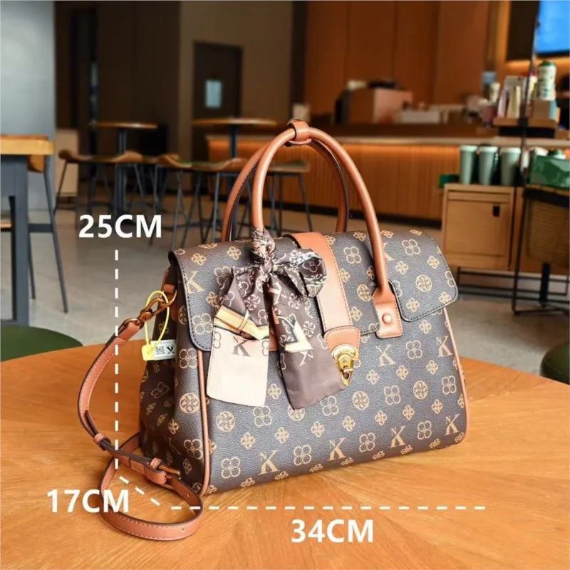 TÍTULO  Bolsa Satchel Monograma Victoria
